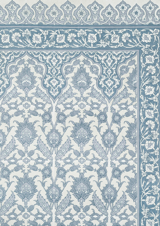 A blue and white rug with an intricate design