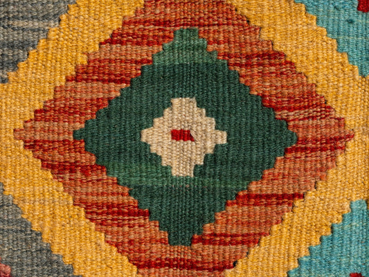 Colorful woven textile with diamond pattern